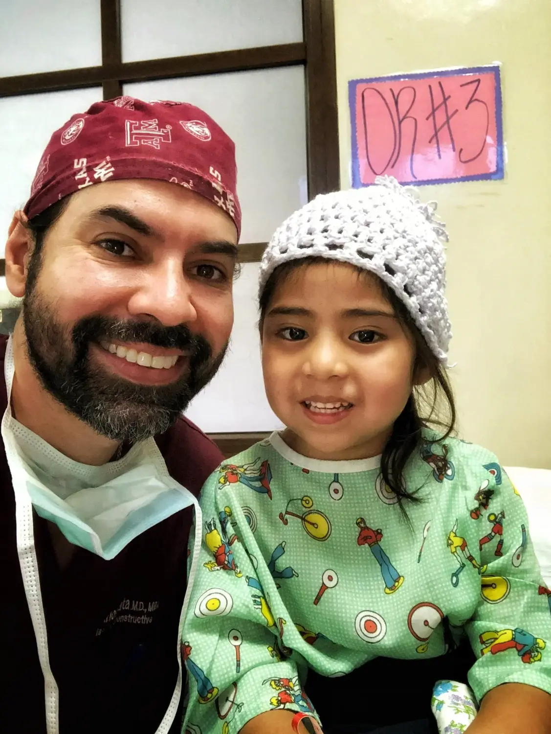Dr. Mata with a young patient during a medical mission