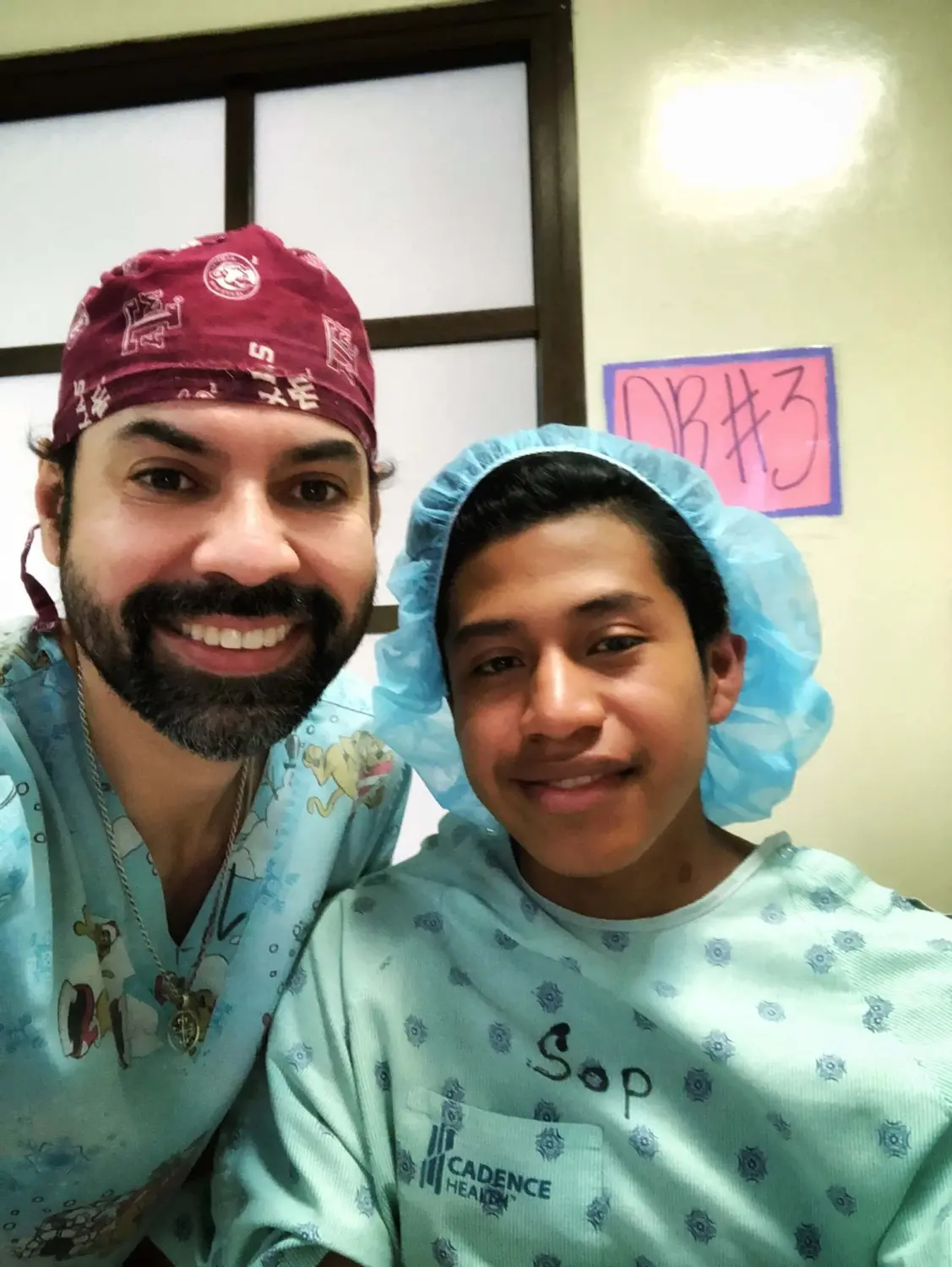 Dr. Mata holding a young child after consultation