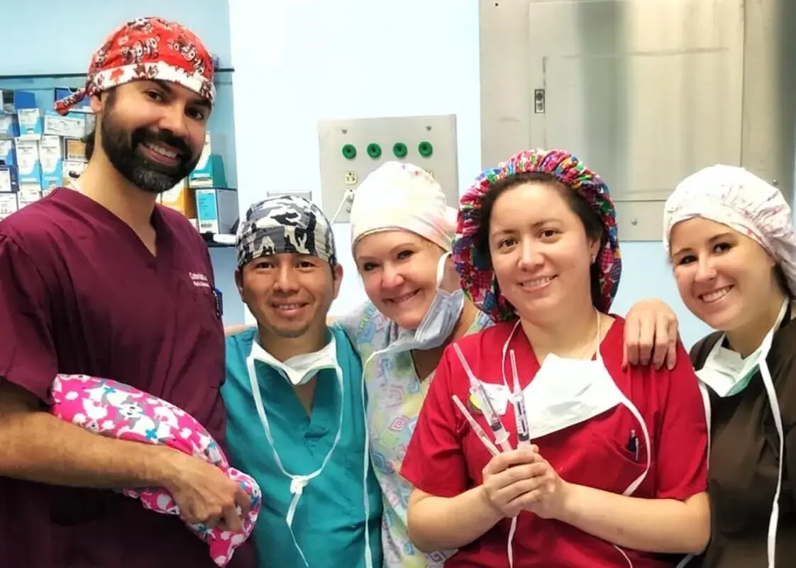 Dr. Mata with the surgical mission team in scrubs